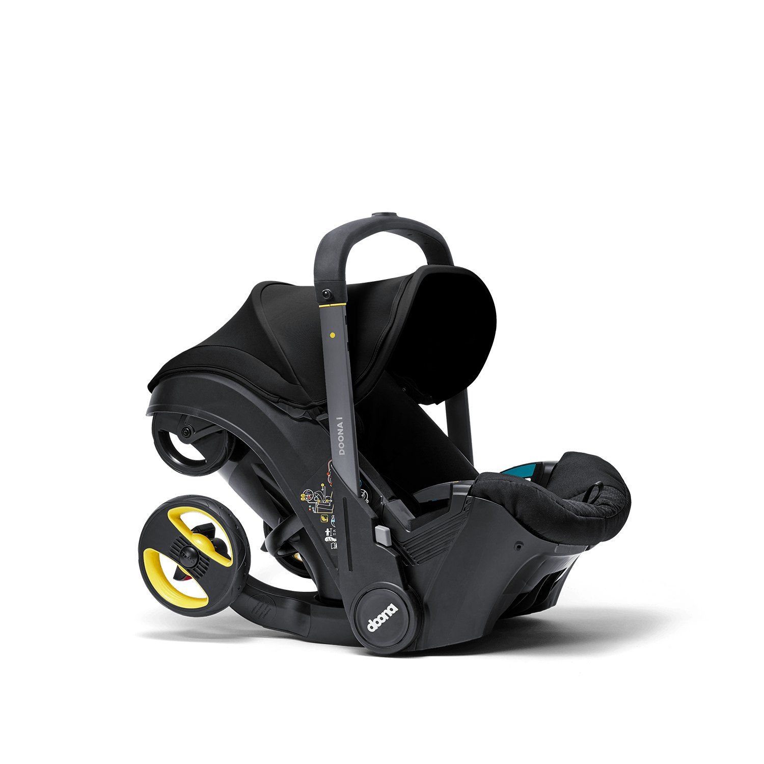 Doona i en mode siège auto, roues repliées, vu de trois quarts