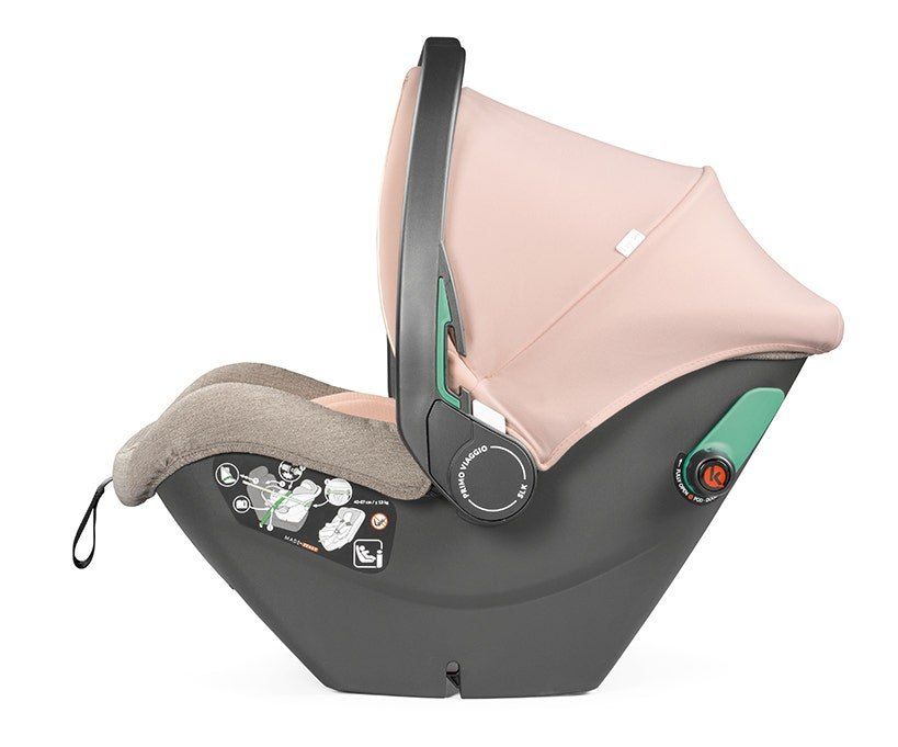 La coque Peg Perego Primo Viaggio SLK vue de profil, capote relevée, beige et rose.